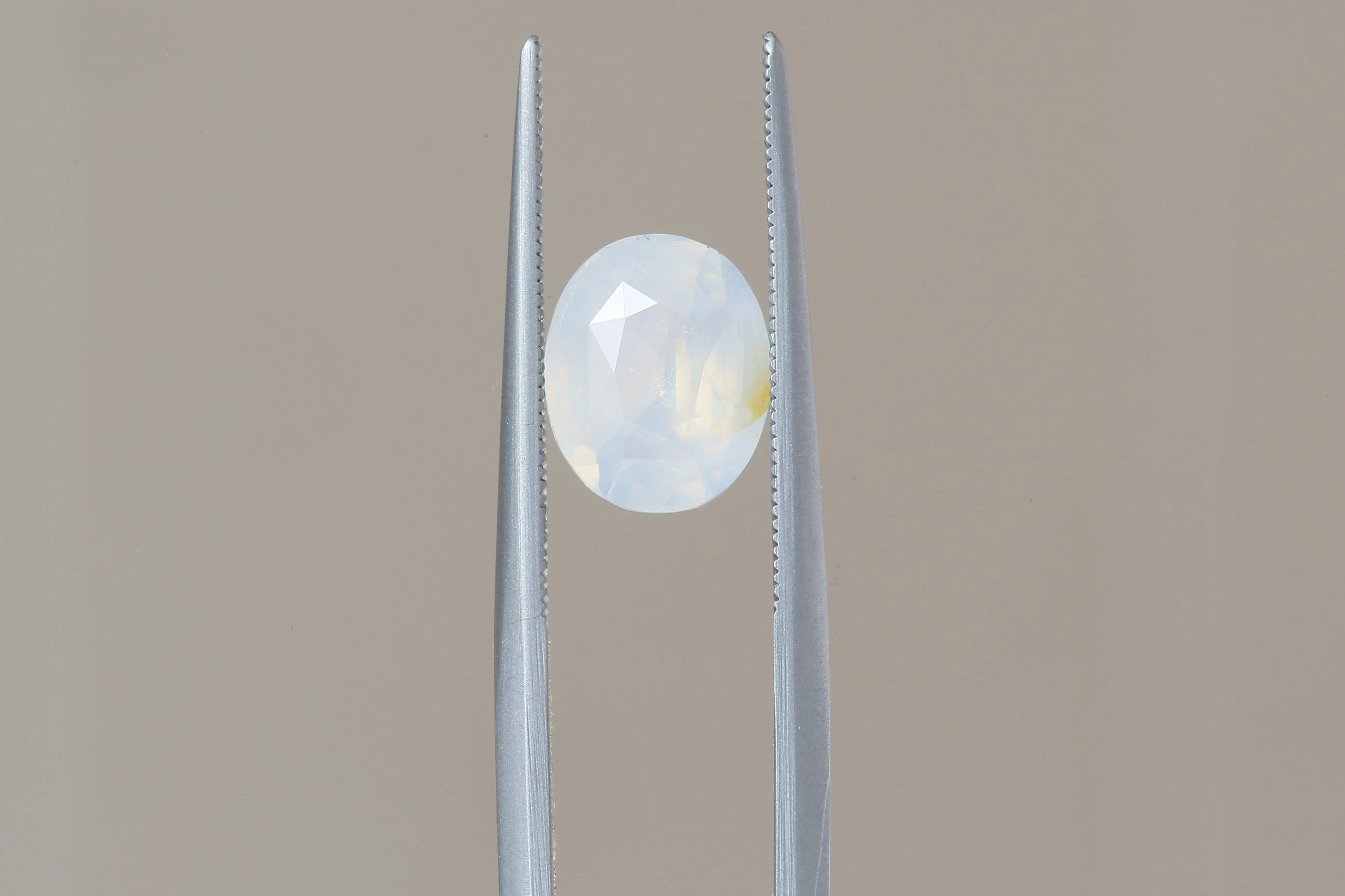 2.56 Carat Natural Opalescent Pale Blue White Oval Sapphire