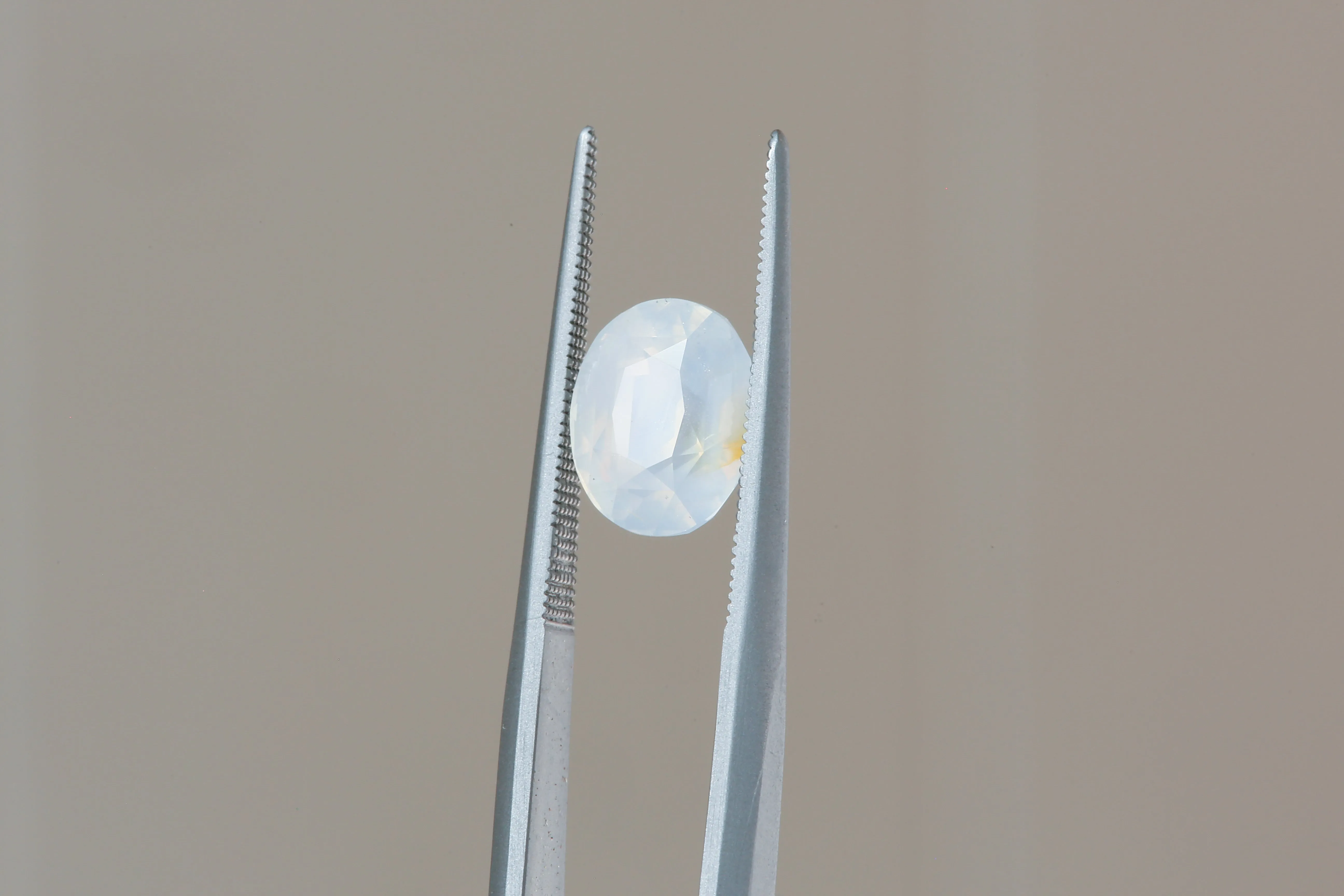 2.56 Carat Natural Opalescent Pale Blue White Oval Sapphire