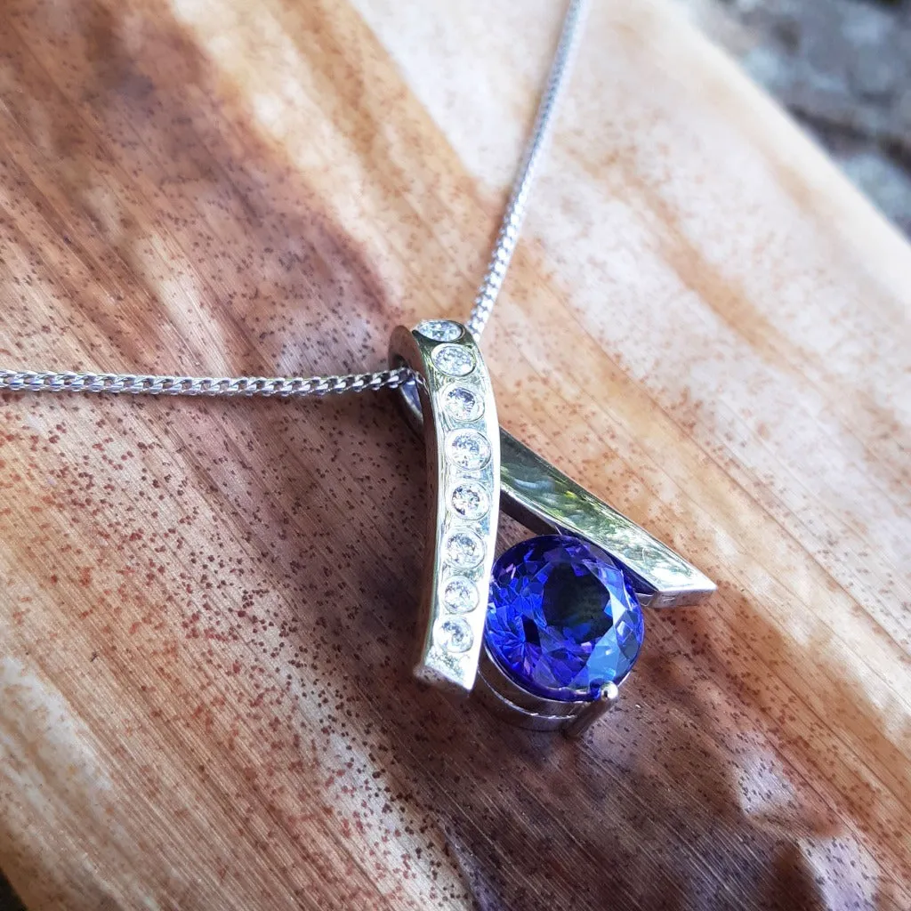 Handcrafted Tanzanite with Eight Diamond Ribbon Pendant